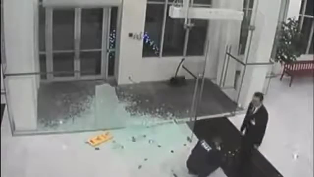 Guy walks through glass doors