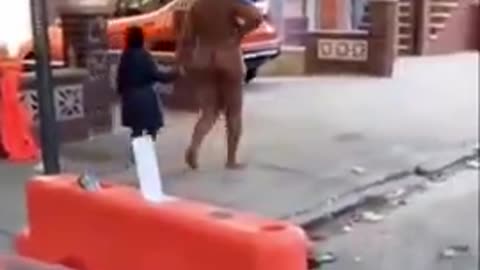 Walking her daughter to school. "Butt Naked"