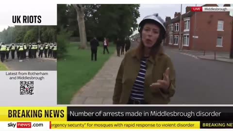 Journalist Looking For White Protestors, While A Gang Of Muslims With Machete's Walks Behind Her!