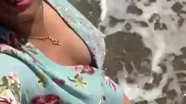 Hot girl walking on the beach