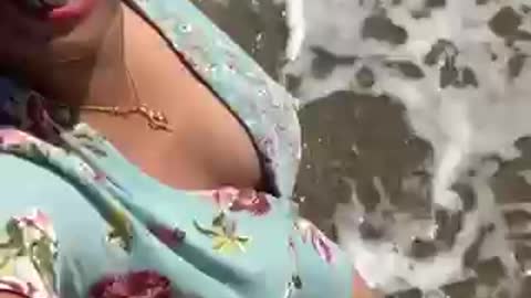 Hot girl walking on the beach