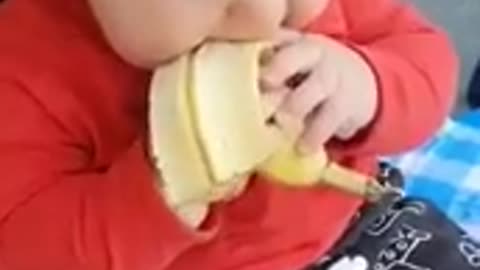 Cute baby enjoying a banana