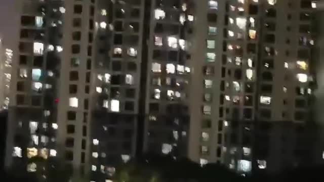 Shanghai, China: People screaming out of their windows after a week of lockdown