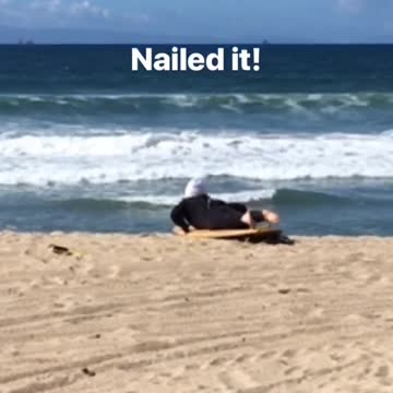 Nailed it beanie guy stands up on orange board
