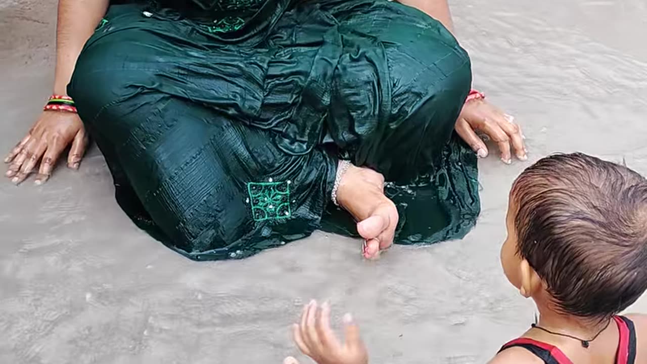 How much fun did mother and son have in the rain together?