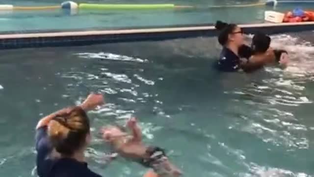 Baby swims naturally.