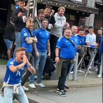 Albania fans snap spaghetti in front of their Italian fans
