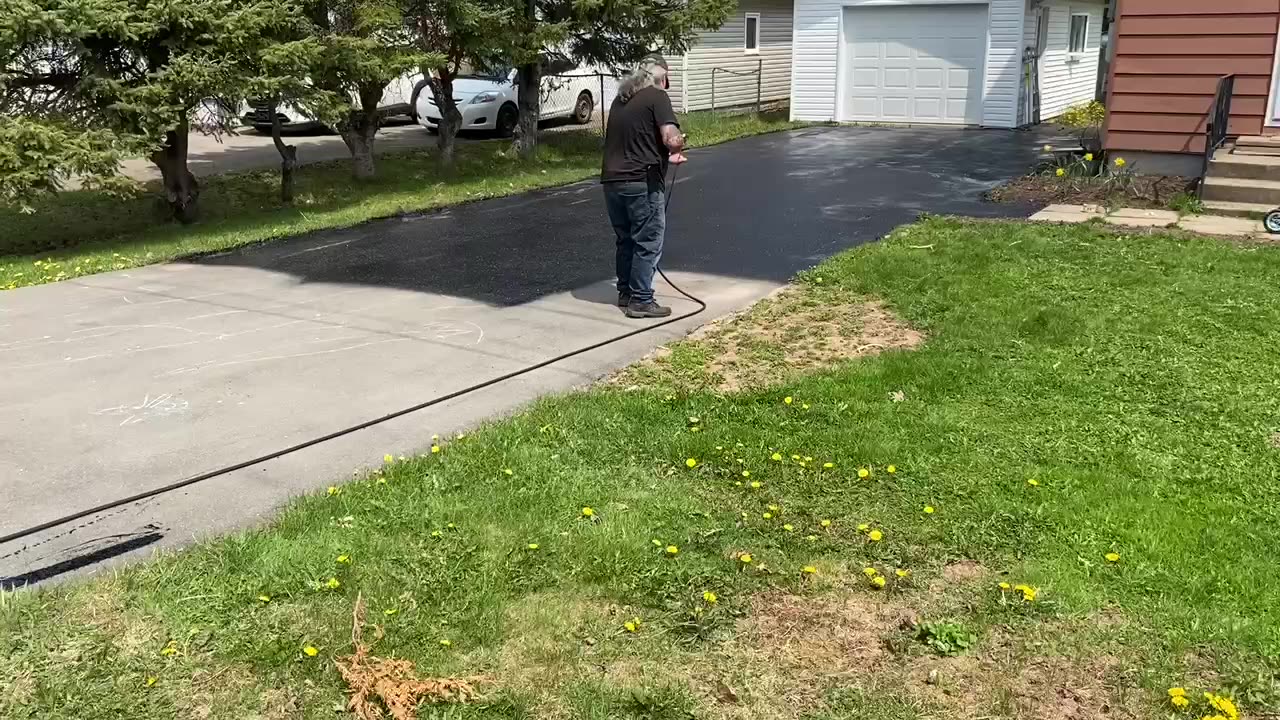 Professional Asphalt Spray Sealing: “The Tiny White Garage One” Top Coats Pavement Maintenance