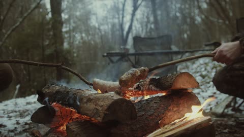 Close Up View of People Grilling on a Open Fire