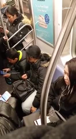 Woman picks boys head green jacket