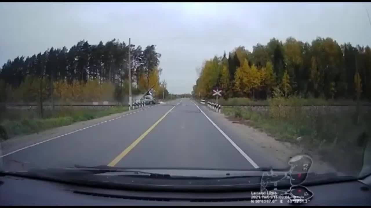 Car Tries To Beat Train At Crossing