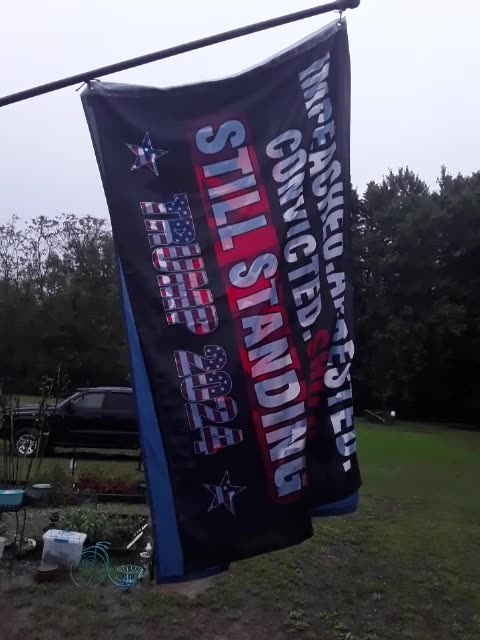 Trump flag in the pouring rain