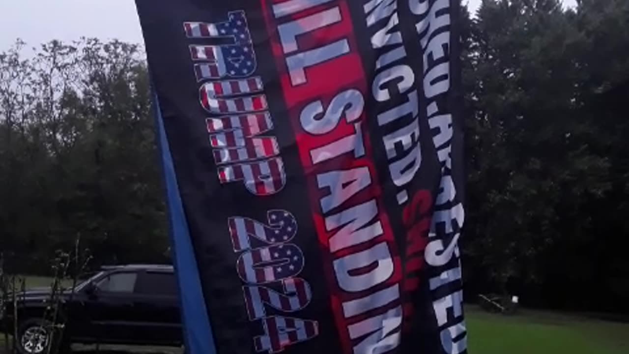 Trump flag in the pouring rain