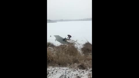 Clever Rescuers Use Table To Help Dog Walker In Icy Lake