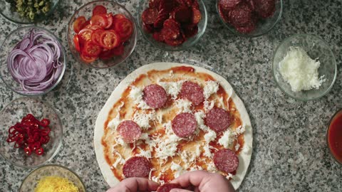 preparing pizza