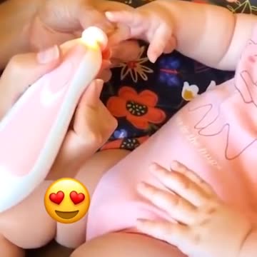 Baby girl takes care of her beauty