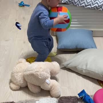 Cute Baby Toddler Playing With A Ball