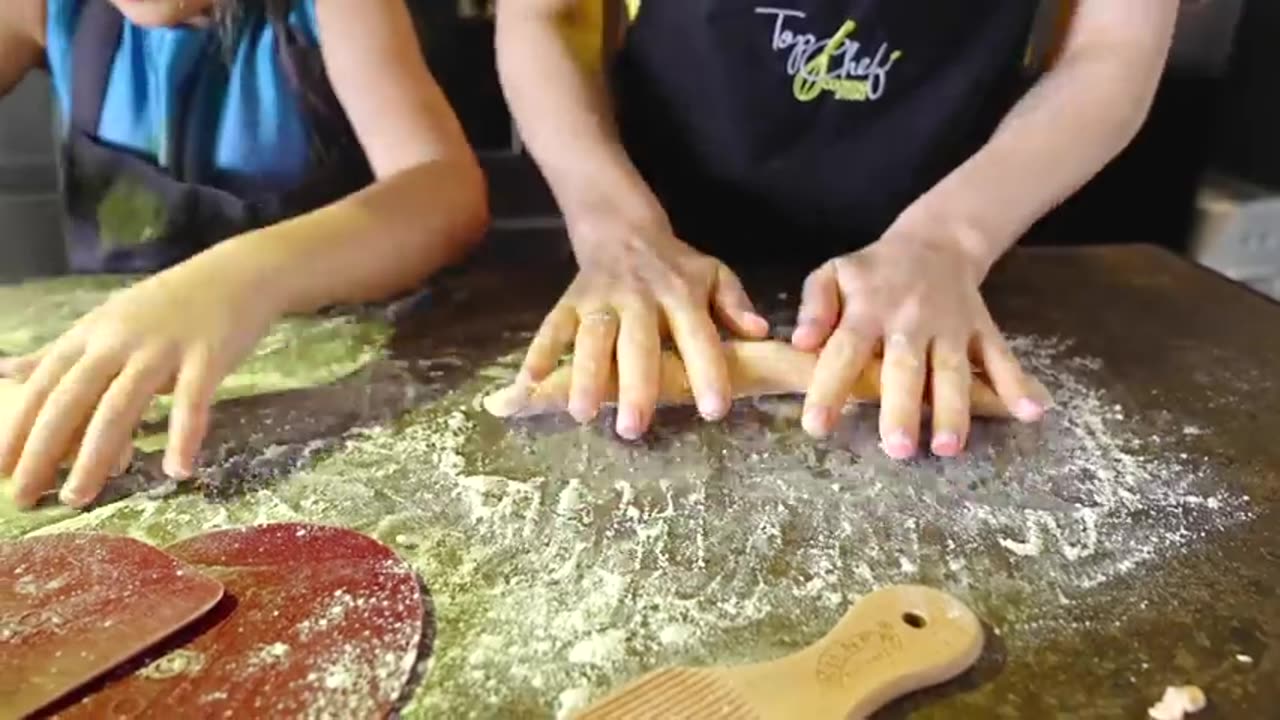 Diana and Roma help mom cook food