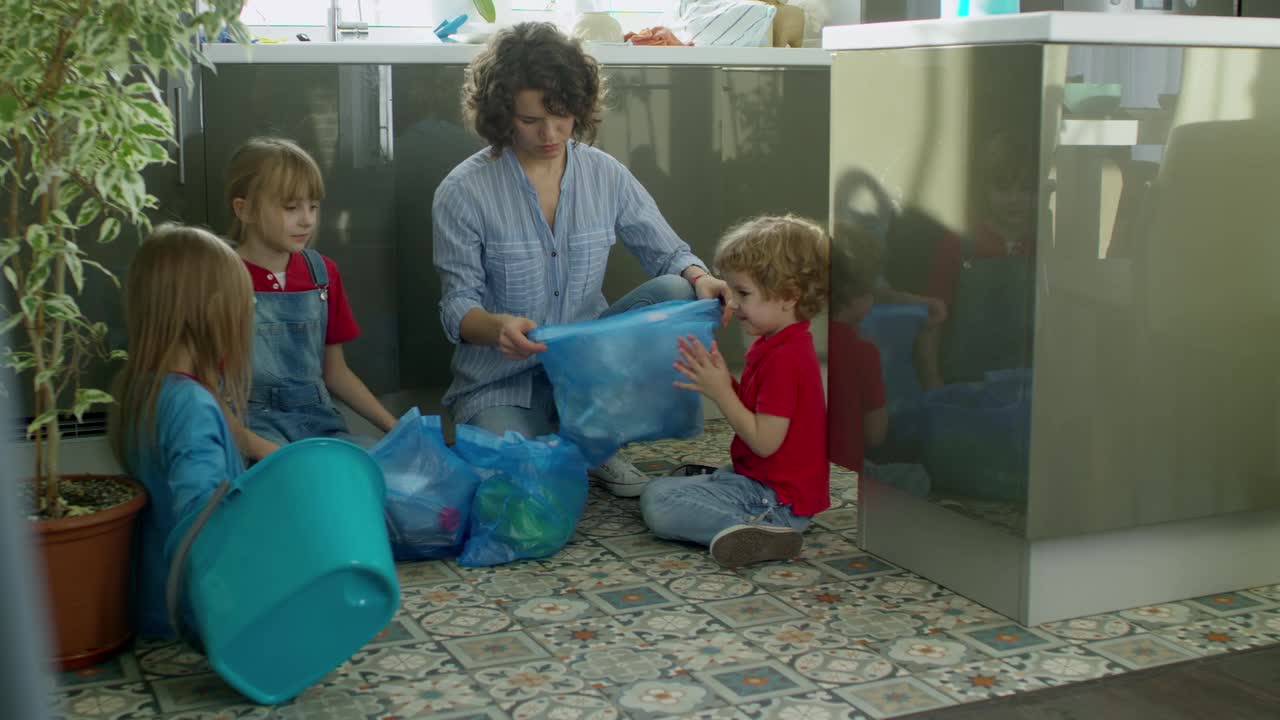 Mother Teaching Her Children About Environmental Care