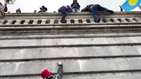 Protesters Climb Capitol Building Walls