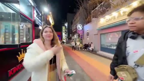 South Korea: Two blacks say they don't agree with race mixing, White girl agrees and salutes them.😁