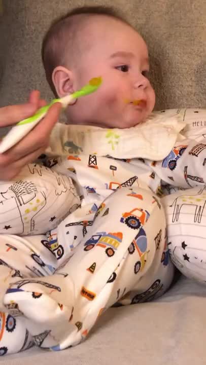 Cute baby eating with Mama