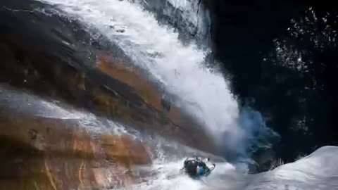 Sliding down a natural waterfall