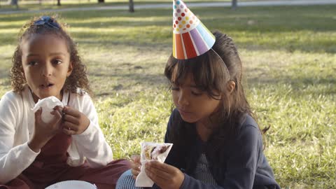 Two Girls Eating Cake