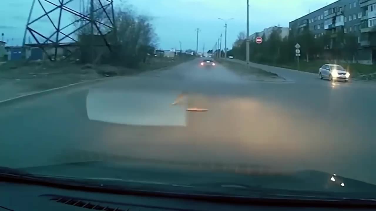 Car Rips Open Pot Hole Lid on Road