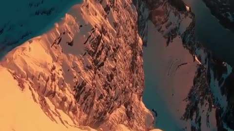 Daredevil walks to edge of mountain cliff for spectacular view
