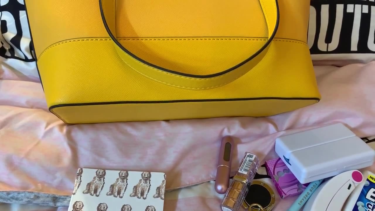 What will fit in the Guess Rigden Marigold Shoulder Bag