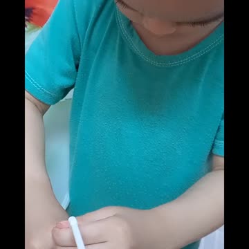 baby drinking milk by himself