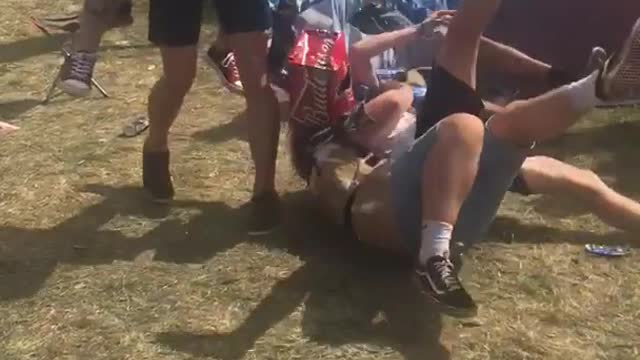 Guys playing sword fight and falling