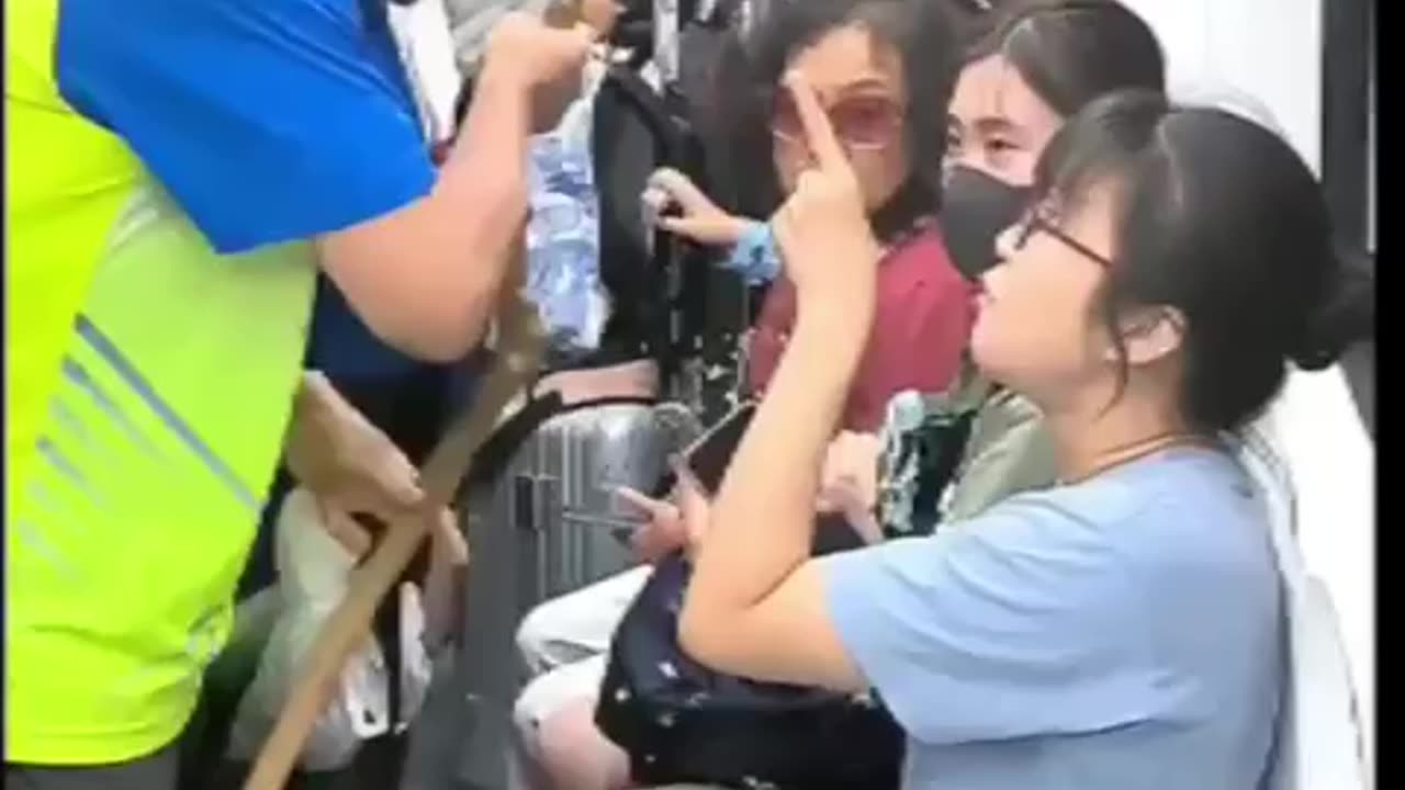 A man on a subway in northern China forcibly demanding a seat from a girl.