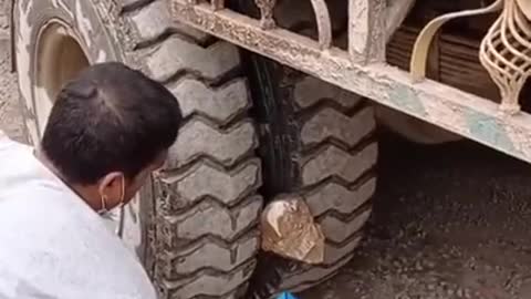 Removing a stuck stone from a truck tire