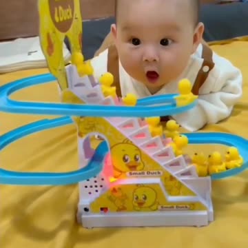 Little baby playing toys and exightment