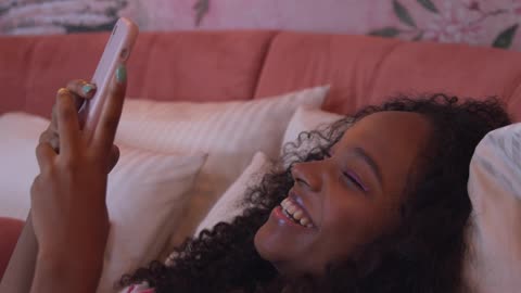 The 👧 girl is watching videos and cute smiles 🥰 videos