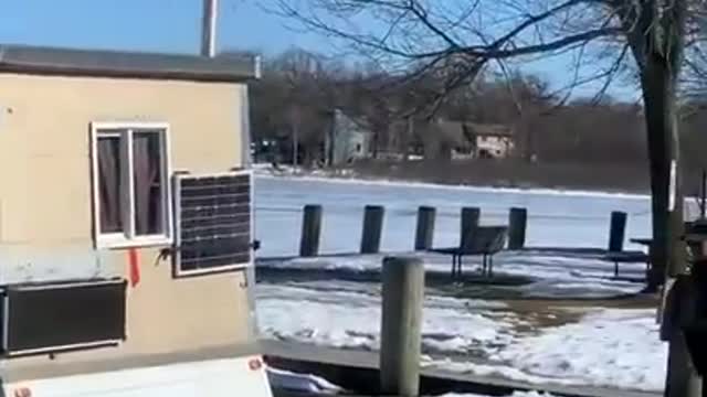 Ice Shanty Detaches From ATV While Being Pulled Towards Frozen Lake Shore