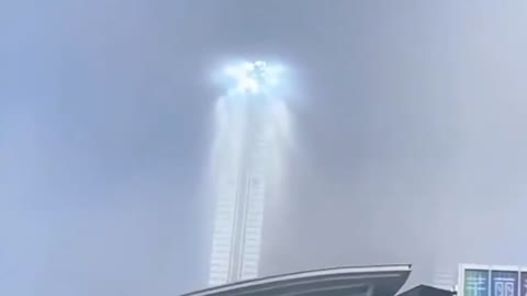 Mysterious tower of light hovers like a UFO in the sky