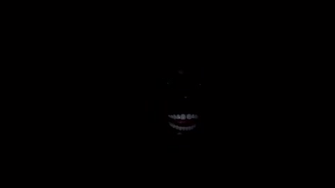 Black Man Laughing in Complete Darkness