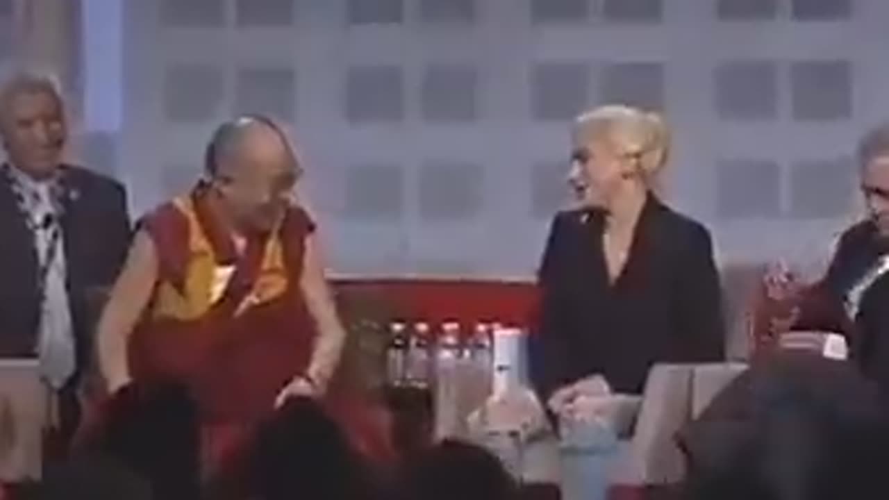 Dalai Lama trying to get a feel of Lady Gaga.