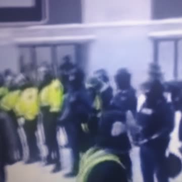 Police facing off with protest with batons in hand in Ottawa. Canada