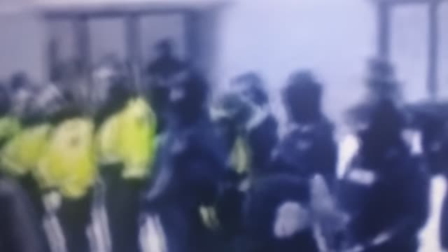 Police facing off with protest with batons in hand in Ottawa. Canada