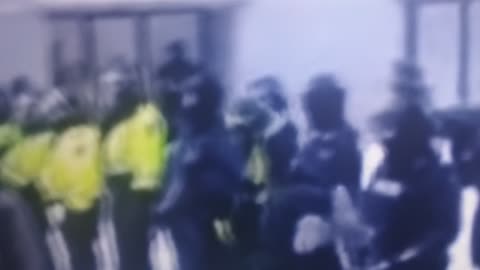 Police facing off with protest with batons in hand in Ottawa. Canada