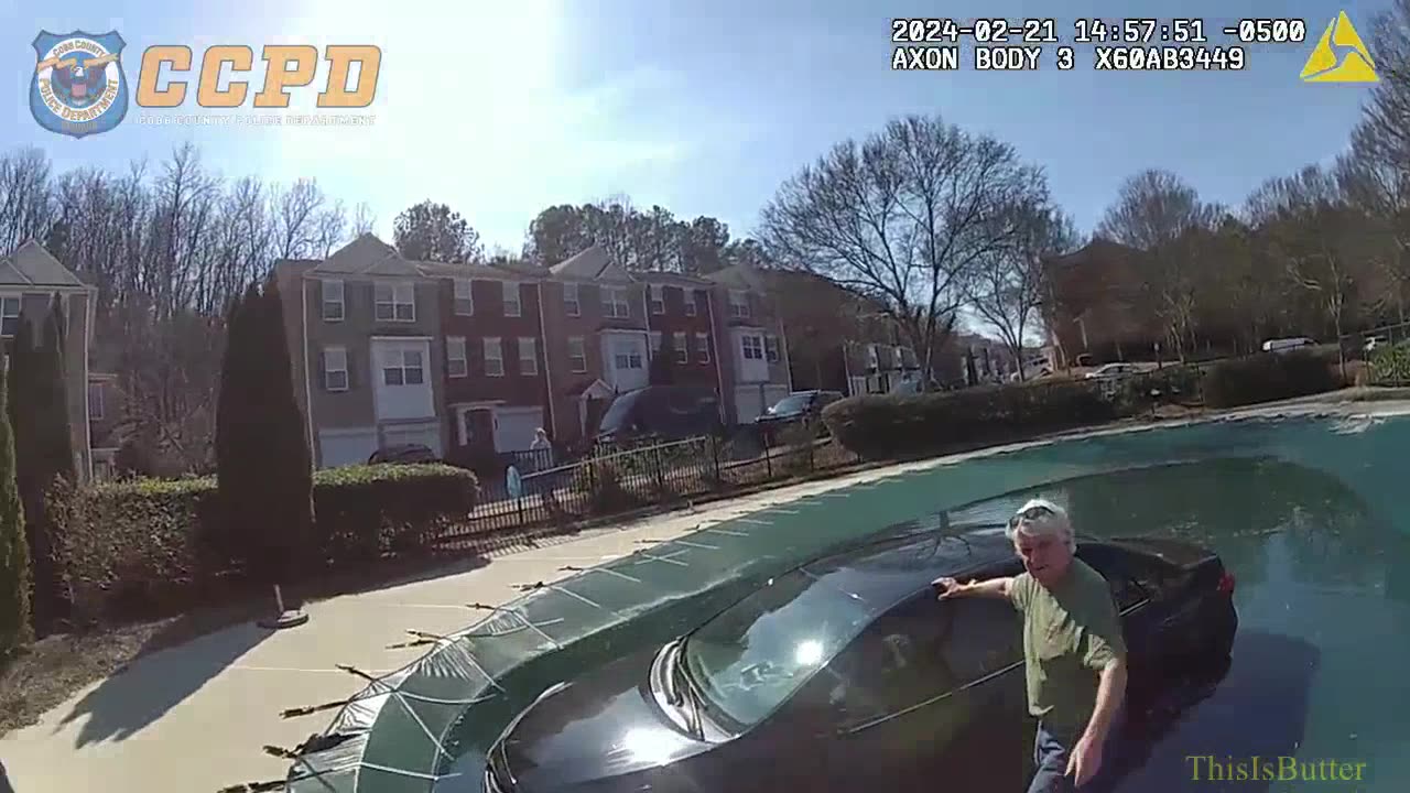 Cobb County police rescue the driver after they crashed into a pool while unconscious