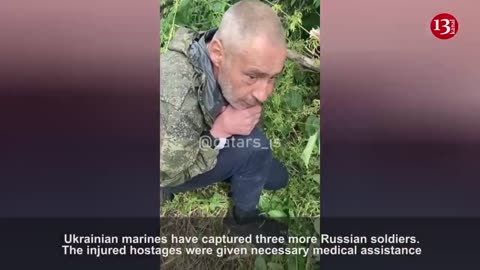 Ukrainian marines provide medical aid to wounded Russians they captured