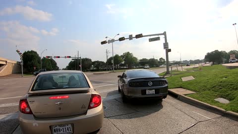 Man Points a Gun at Motorcyclist