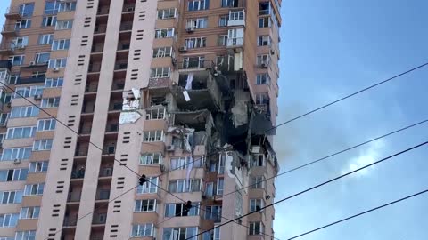 Moment rocket strikes Kyiv apartment block