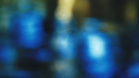 Defocused blue lights reflected in water