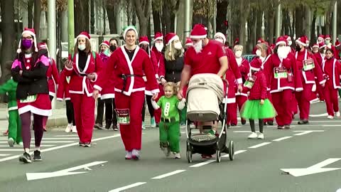Santas stage charity run in Madrid for La Palma